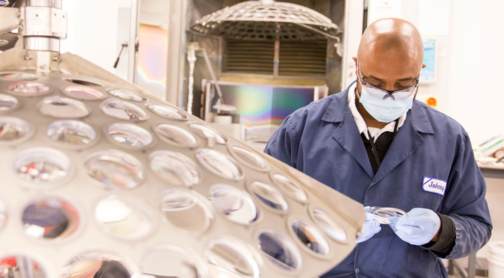 Man working in an optical lab