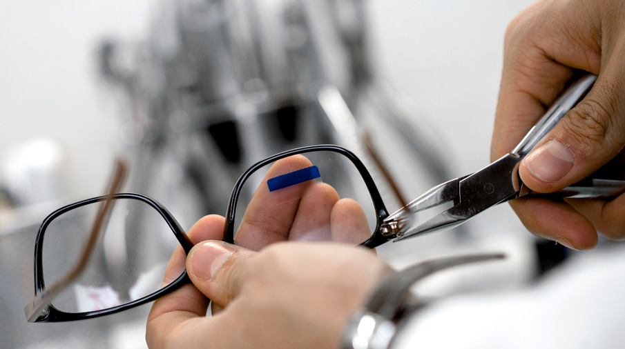 Lab technician adjusting lenses